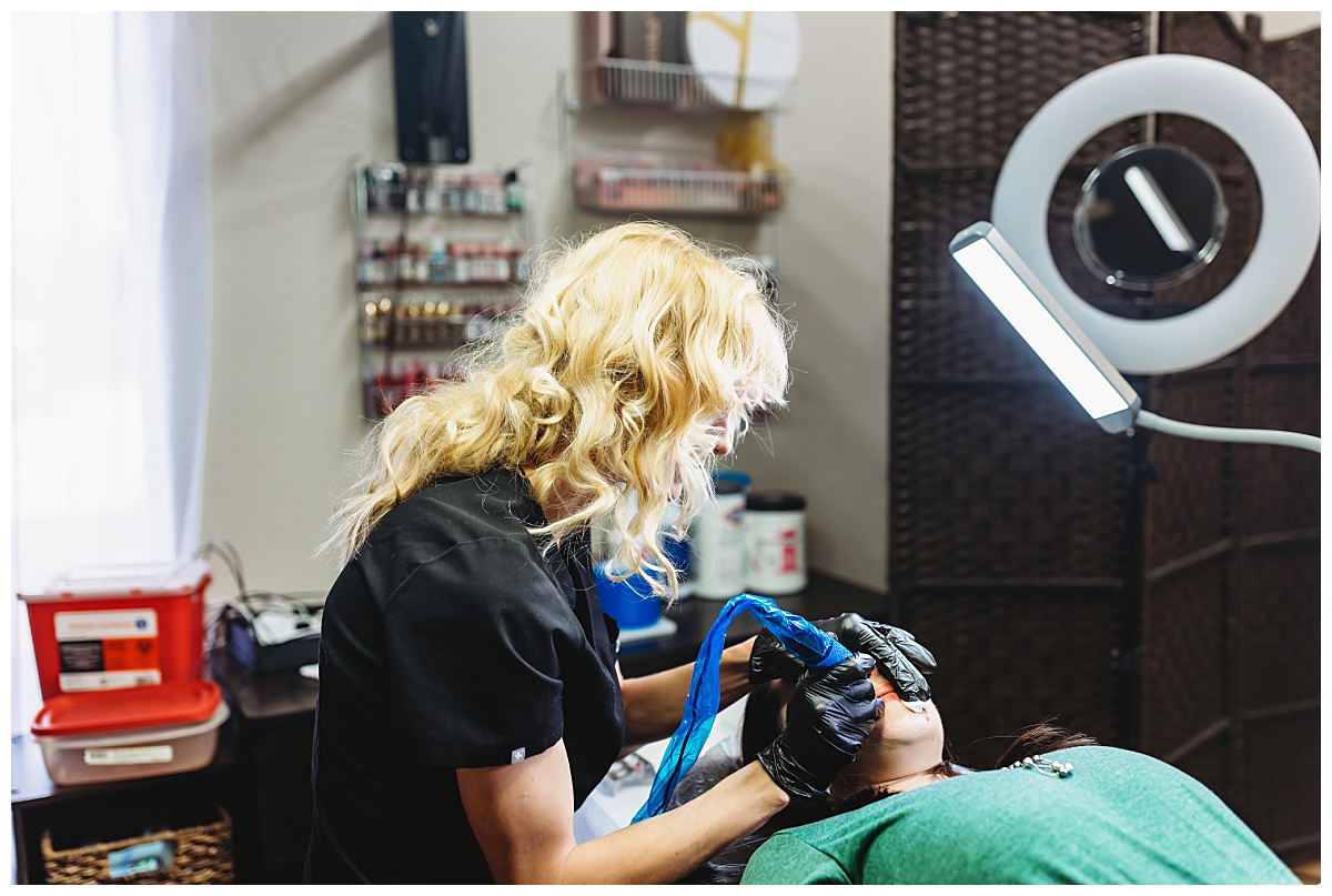 Arizona Permanent Makeup Artist Kelly Reeves tattoos a clients lips during a lip blush procedure.